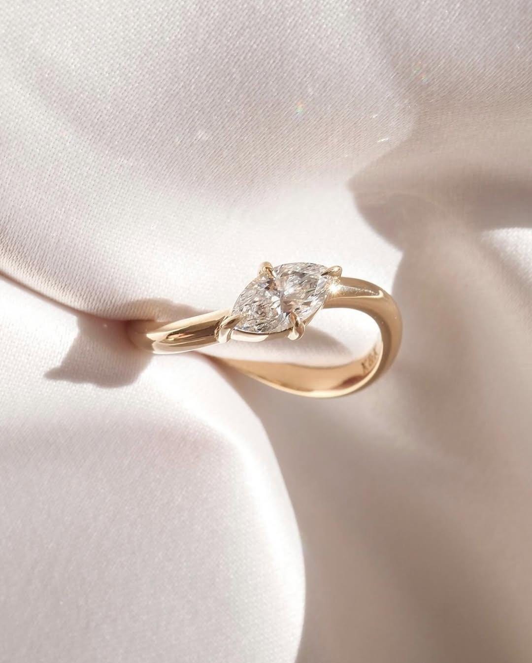 Discover our fine diamond engagement ring, currently available as part of our engagement ring collection with a 1 carat marquise stone. - AuraJewelsCA